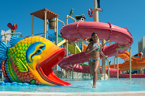 young person wading at a waterpark