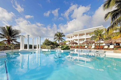 pool outside of a tropical resort