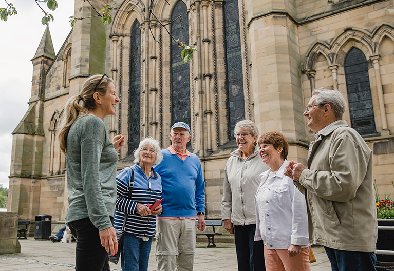 group on a tour of an old church building