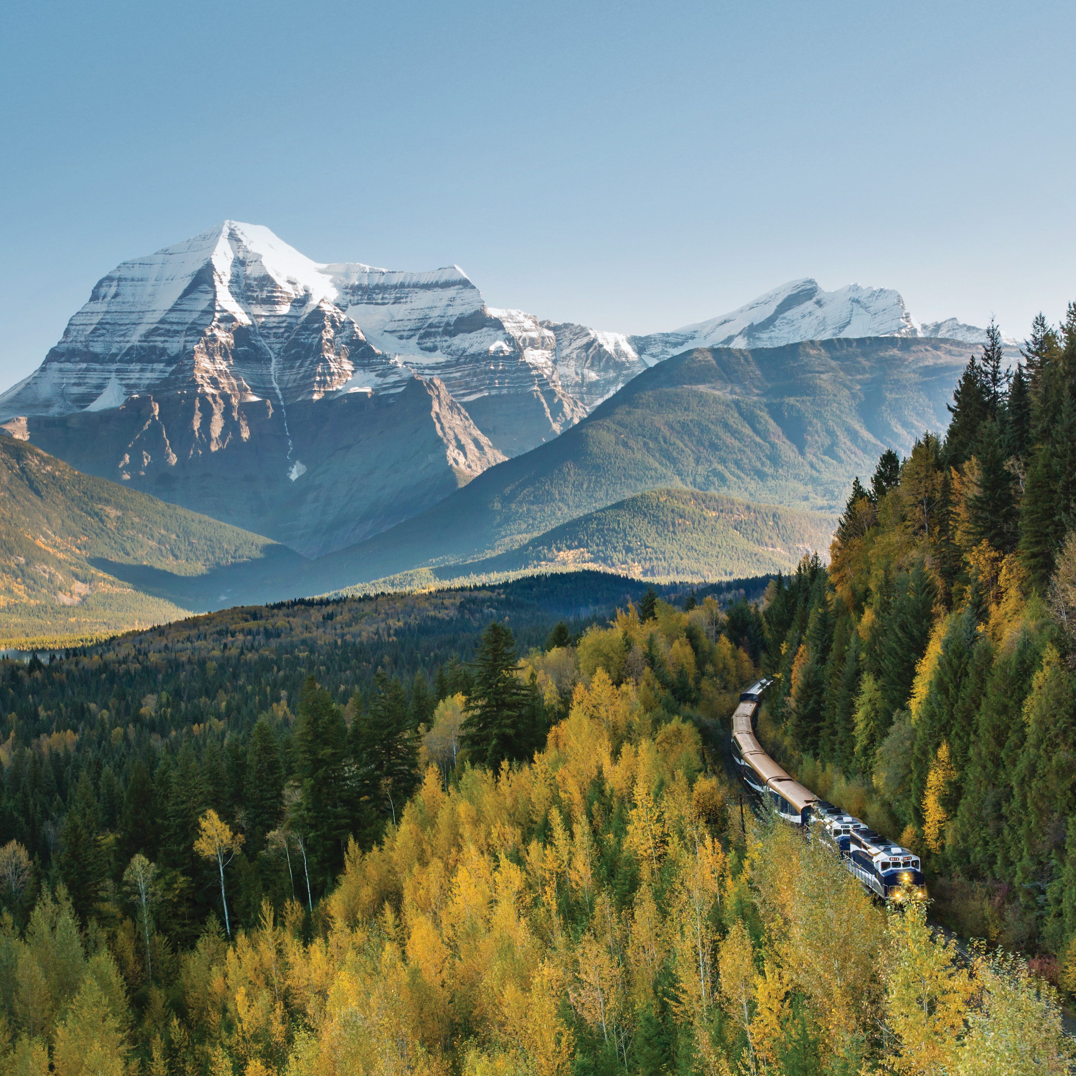 a train passing through a mountain valley
