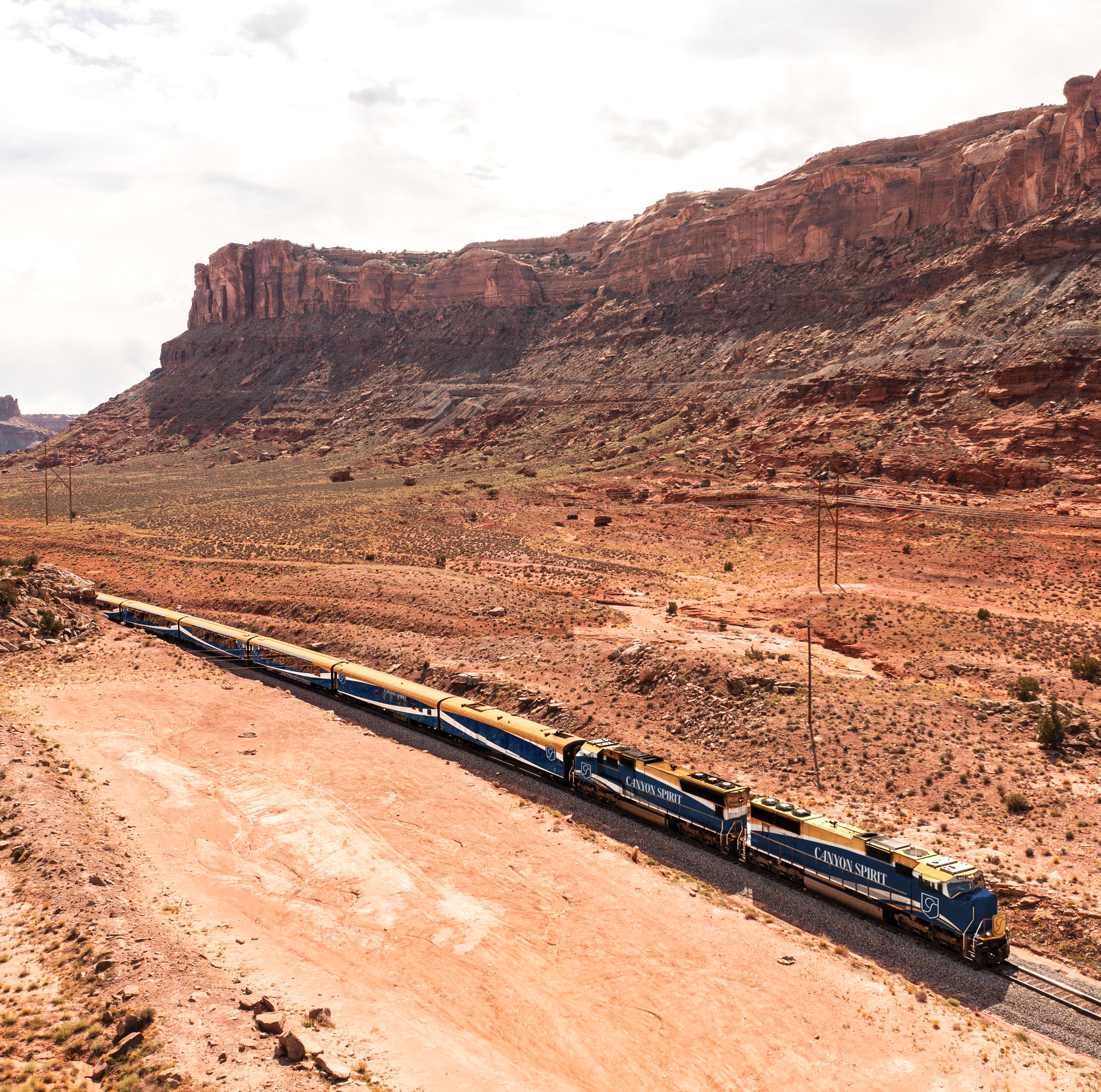 a train passes through a western canyon