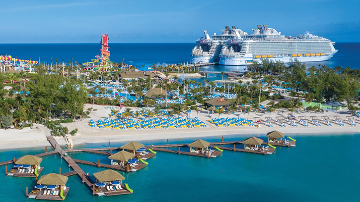 cruise ships docked outside of beach resort