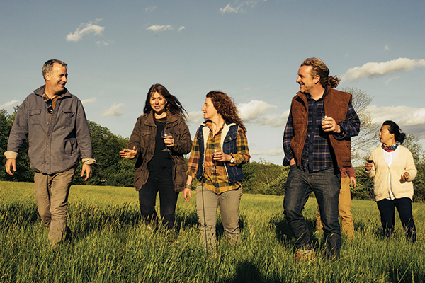 A group of travelers hiking in a field