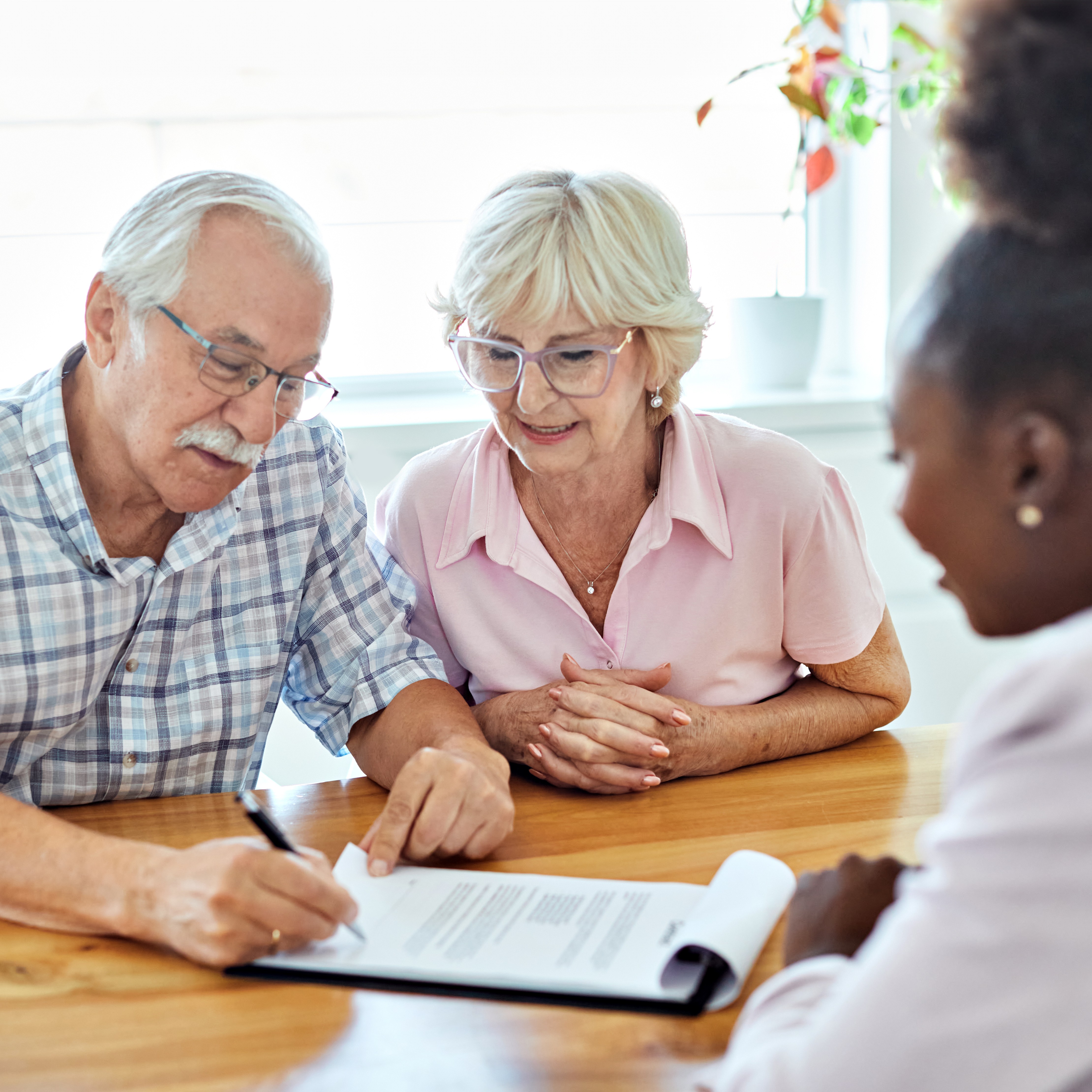 senior couple with insurance advisor